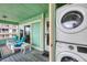 Relaxing outdoor patio area with seating and a washer and dryer at 2350 N Beach Rd # 1B, Englewood, FL 34223