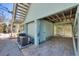 Paved, ground-level area beneath stilted beach house with storage and utilities at 2350 N Beach Rd # 1B, Englewood, FL 34223