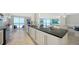 Contemporary open kitchen with granite countertops and views of the Gulf at 2425 Gulf Of Mexico Dr # 3E, Longboat Key, FL 34228