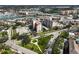 Community aerial view, featuring condos, pool, green spaces, and waterfront access at 244 Saint Augustine Ave # 905, Venice, FL 34285
