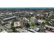 An aerial view of the city, the condo and nearby buildings with swimming pools at 244 Saint Augustine Ave # 905, Venice, FL 34285