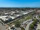 Aerial view of the neighborhood showcasing the beach, city, and nearby commercial district at 244 Saint Augustine Ave # 905, Venice, FL 34285