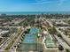 Aerial view featuring tennis courts and sports fields in a recreation area near the beach and neighborhood at 244 Saint Augustine Ave # 905, Venice, FL 34285