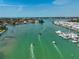 Waterfront property aerial view showcasing boat access, docks, and nearby residential community at 244 Saint Augustine Ave # 905, Venice, FL 34285