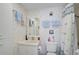 Bathroom featuring floral wallpaper, sink and vanity, a toilet and a shower curtain at 244 Saint Augustine Ave # 905, Venice, FL 34285