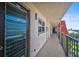 Exterior hallway leading to unit with exterior window and view of community at 244 Saint Augustine Ave # 905, Venice, FL 34285