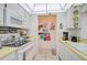Functional kitchen layout showcasing practical storage, counter space, and an open view to the next room at 244 Saint Augustine Ave # 905, Venice, FL 34285