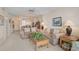 Open-concept living space with comfortable seating, coffee table, and seamless connection to the dining area at 244 Saint Augustine Ave # 905, Venice, FL 34285