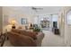 Cozy living room with comfortable sofa, lamps, coffee table and access to a balcony with a view at 244 Saint Augustine Ave # 905, Venice, FL 34285