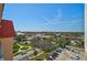 A bright scenic view from the condo balcony overlooking a lush green park and the surrounding residential neighborhood at 244 Saint Augustine Ave # 905, Venice, FL 34285
