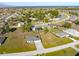 This aerial shot shows an overview of the property and surrounding neighborhood at 25259 Alcazar Dr, Punta Gorda, FL 33955