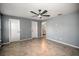 Spacious bedroom with tile flooring, two closets, and ceiling fan at 25259 Alcazar Dr, Punta Gorda, FL 33955