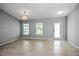Bright dining area with tile floors, a chandelier, and natural light streaming through the windows at 25259 Alcazar Dr, Punta Gorda, FL 33955