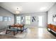 Cozy dining area featuring a wooden table, bench seating, and a decorative chandelier for ambiance at 25259 Alcazar Dr, Punta Gorda, FL 33955