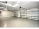 This is a spacious three car garage featuring an epoxy floor and storage at 25259 Alcazar Dr, Punta Gorda, FL 33955