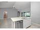 Kitchen island with stainless steel dishwasher and double sink in a neutral-toned space at 25259 Alcazar Dr, Punta Gorda, FL 33955