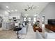 Spacious living area open to the kitchen, with modern decor and plenty of seating for guests at 25259 Alcazar Dr, Punta Gorda, FL 33955