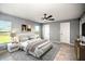 Nicely decorated main bedroom with neutral tones, fan, and ample natural light at 25259 Alcazar Dr, Punta Gorda, FL 33955