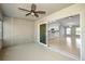 A sliding glass door leads from the patio to an open floor plan with views of the kitchen at 25259 Alcazar Dr, Punta Gorda, FL 33955