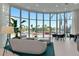 Comfortable lobby space with large windows offering an exterior view, upscale furniture, and plants at 301 Quay Cmn # 1005, Sarasota, FL 34236