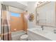 Bathroom featuring a combination shower and tub, large mirror and vanity with white countertops at 3189 Seattle Ave, North Port, FL 34286