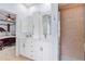 Bathroom featuring double sinks, granite countertops, walk-in shower, and access to the bedroom at 3189 Seattle Ave, North Port, FL 34286