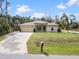 Attractive one-story house with well-manicured lawn and ample parking at 3189 Seattle Ave, North Port, FL 34286