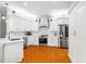 Modern kitchen with stainless steel appliances, white cabinets, and a marble backsplash at 3189 Seattle Ave, North Port, FL 34286