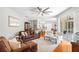 Open living room with hardwood floors, a ceiling fan, and an open floorplan at 3189 Seattle Ave, North Port, FL 34286