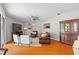Bright and airy living room featuring hardwood floors and neutral decor at 3189 Seattle Ave, North Port, FL 34286