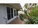Charming back porch and outdoor seating offer serene views of the beautifully landscaped yard at 3333 26Th E Ave # 28, Bradenton, FL 34208