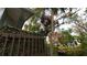 Backyard of the home with a view of the canal, tall palm trees, and an American flag at 3333 26Th E Ave # 28, Bradenton, FL 34208