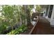 Backyard featuring lush greenery with a small deck overlooking mature trees at 3333 26Th E Ave # 28, Bradenton, FL 34208