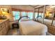 A cozy bedroom featuring a comfortable bed, dresser, and a mirrored closet at 3333 26Th E Ave # 28, Bradenton, FL 34208