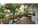 Inviting deck overlooking a serene canal, furnished with seating and an American flag, perfect for relaxing outdoors at 3333 26Th E Ave # 28, Bradenton, FL 34208