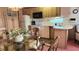 A cozy kitchen features wood cabinets and modern appliances; a perfect spot to prepare meals at 3333 26Th E Ave # 28, Bradenton, FL 34208