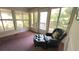 Inviting sun room with an armchair, large windows, and natural light overlooking the beautiful scenery at 3333 26Th E Ave # 28, Bradenton, FL 34208