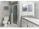 Bathroom featuring granite countertop and modern tiled shower at 3815 Muirfield Ct, Palm Harbor, FL 34685