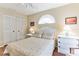 Bedroom features neutral walls, modern flooring, and ample closet space at 3815 Muirfield Ct, Palm Harbor, FL 34685