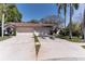 Charming home featuring a tile roof, attached two-car garage, and lush landscaping at 3815 Muirfield Ct, Palm Harbor, FL 34685