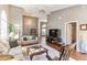 Spacious living room featuring hardwood floors, ceiling fan, and neutral paint at 3815 Muirfield Ct, Palm Harbor, FL 34685