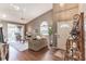 Inviting living room featuring wood floors, cathedral ceilings, and sliding door access to an outdoor patio at 3815 Muirfield Ct, Palm Harbor, FL 34685