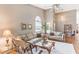Bright living room featuring vaulted ceilings, comfortable seating, and lots of natural light at 3815 Muirfield Ct, Palm Harbor, FL 34685