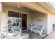 Covered patio with comfortable seating, ideal for relaxing and enjoying the outdoor ambiance at 3815 Muirfield Ct, Palm Harbor, FL 34685