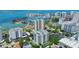 Breathtaking aerial view showcasing the coastline, marina, and cityscape, highlighting the vibrant urban setting at 401 S Palm Ave # 801, Sarasota, FL 34236