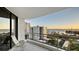 Condo balcony featuring tile floors, seating and stunning views of the water and nearby buildings at 401 S Palm Ave # 801, Sarasota, FL 34236
