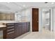 Bathroom featuring a vanity, walk-in shower, and toilet with a large mirror at 401 S Palm Ave # 801, Sarasota, FL 34236