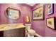 Stylish powder room with a vessel sink, round mirror, and colorful decor at 401 S Palm Ave # 801, Sarasota, FL 34236