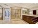 Spacious bathroom with glass shower, vanity with drawers, and tile flooring at 401 S Palm Ave # 801, Sarasota, FL 34236
