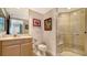 Bathroom featuring a stand up shower with glass doors and a wooden vanity with sink at 401 S Palm Ave # 801, Sarasota, FL 34236